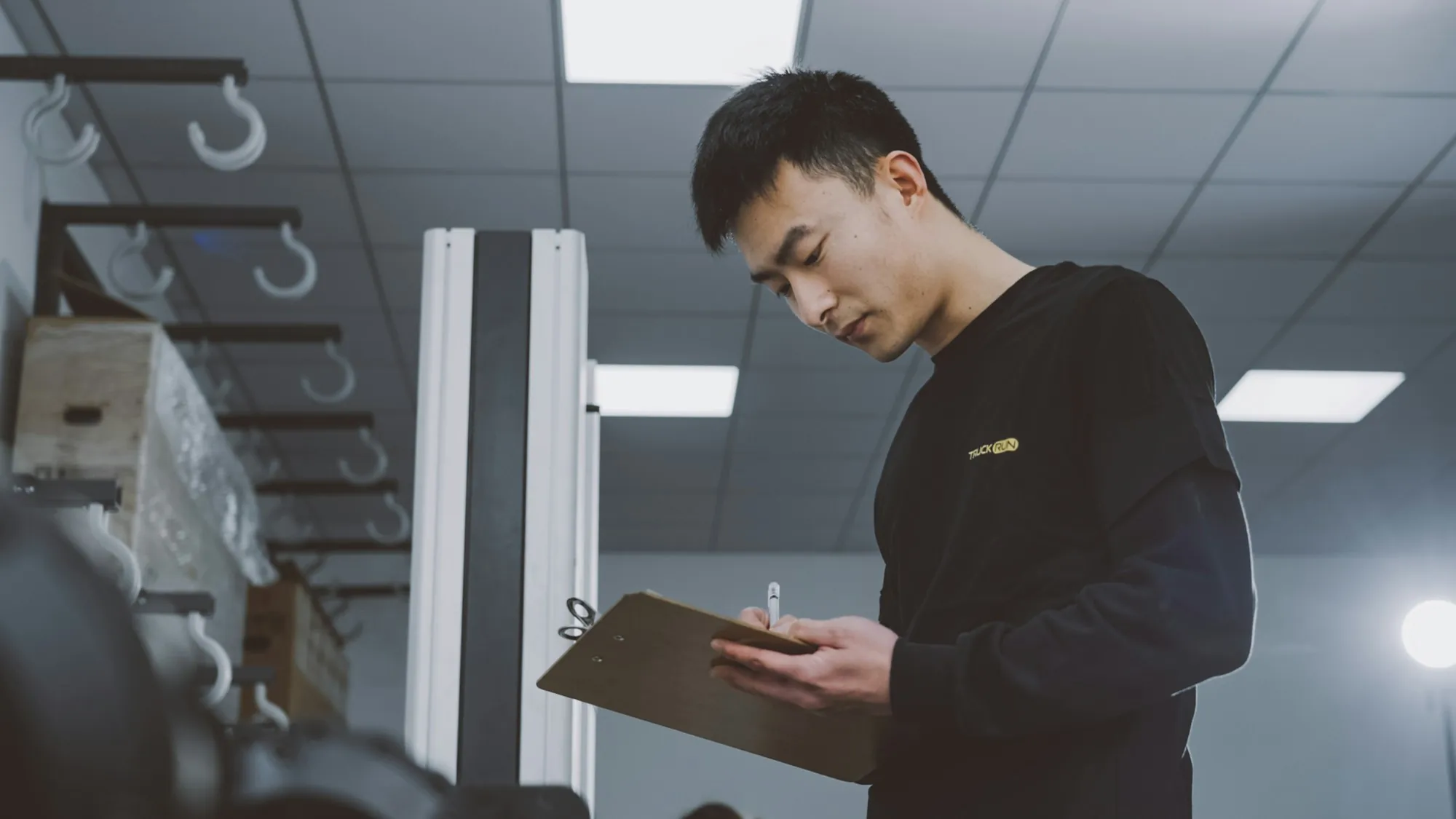 Electrician reviewing job notes on a clipboard