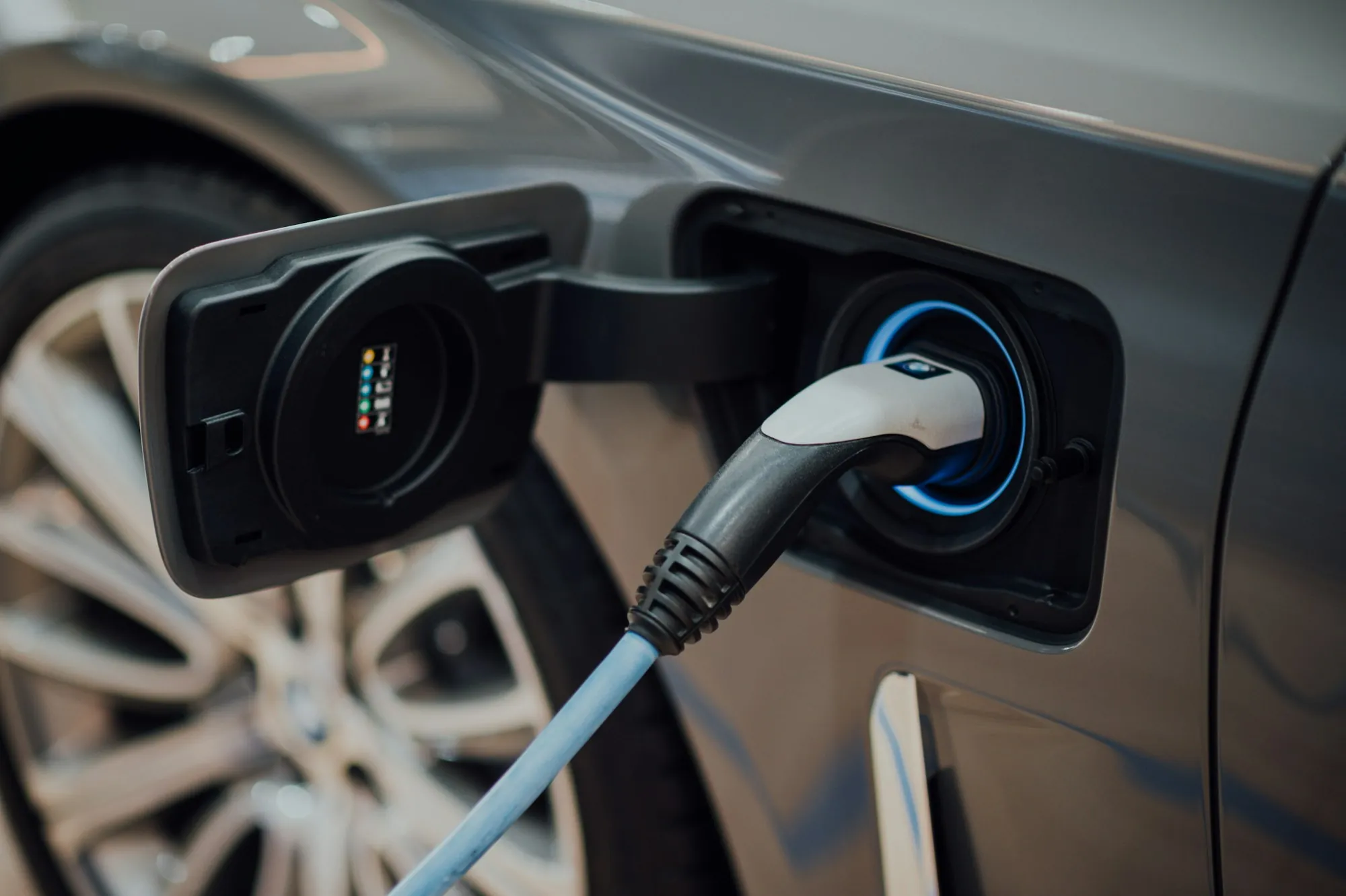 Charging cable connected to the port of an electric car